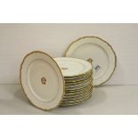 Fourteen 19th century French ' Lahoche & Pannier ' cream ground and gilt decorated dinner plates