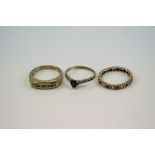 Three ladies 9ct Gold and gemstone rings to include a full eternity ring.