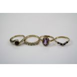 Four ladies 9ct gold and gemstone rings to include a sapphire wishbone ring.