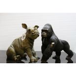 Leonardo collection figure of a mountain gorilla and a similar baby Rhino.
