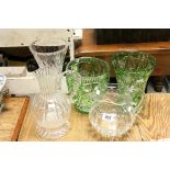 A group of glassware to include cut glass green vases, fluted jugs ,vases etc..