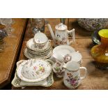 A group of late 19th early 20th century floral decorated Dresden china cups, saucers, teapot etc.