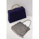 An early 20th century evening bag, silver coloured beads and tassels, the clasp with raised swag and