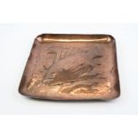 A vintage Newlyn school copper dish with fish decoration, marked Newlyn to base.