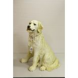 A large resin Border Fine Arts Golden Retriever dog.