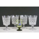 Four 19th century cut glass rummers wuth star cut bases and single knop stem together with a