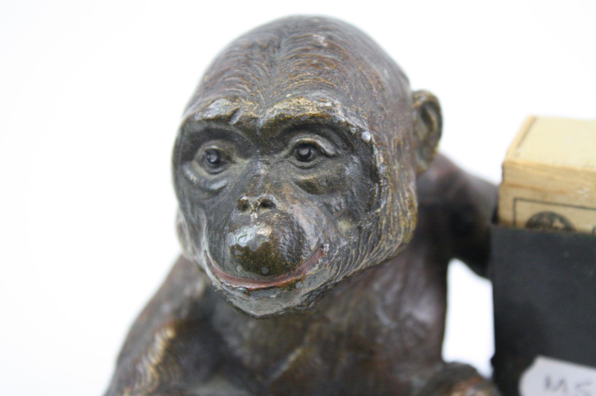 An early 20th century cold painted spelter match holder in the form of a monkey. - Image 2 of 6