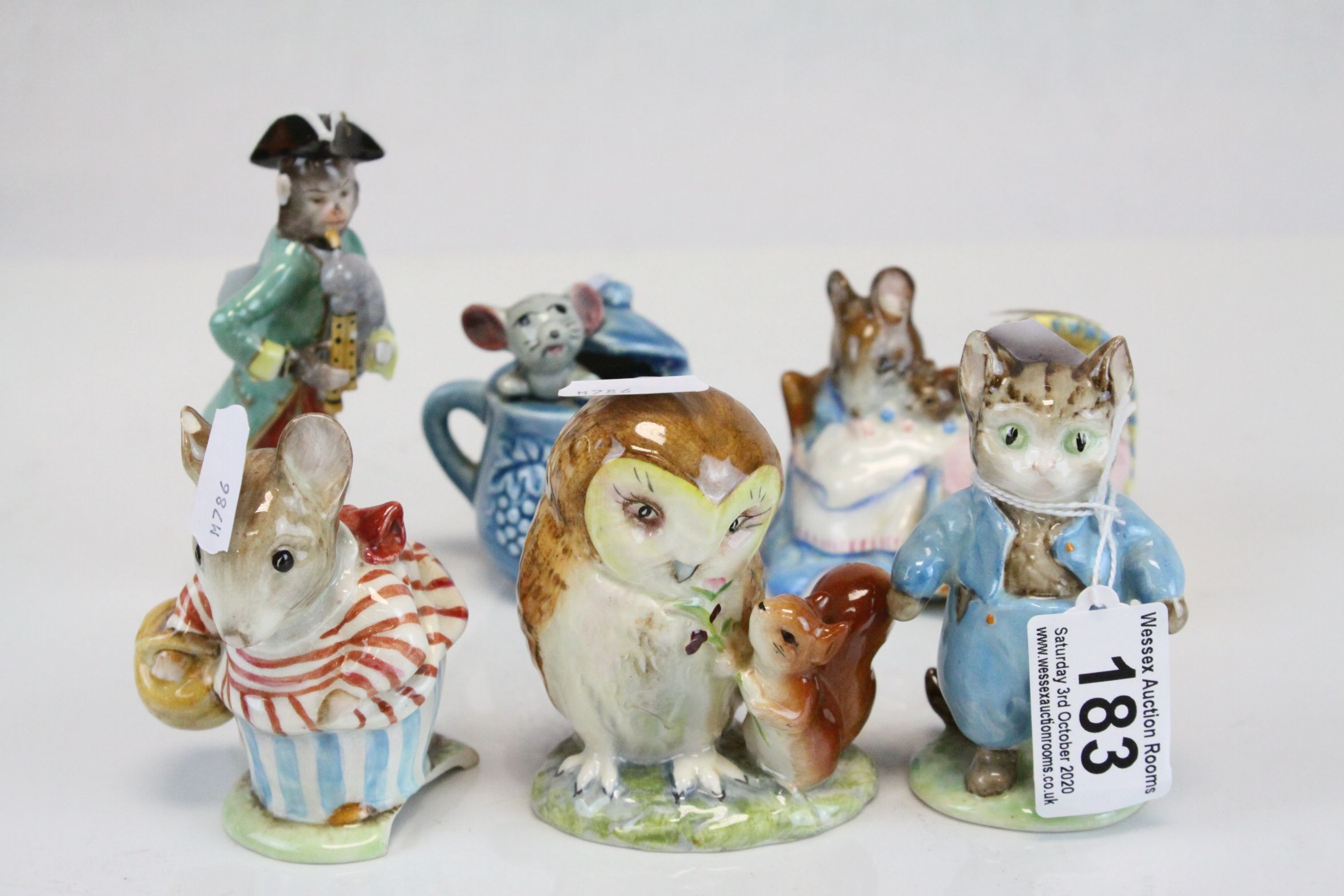 Two Beswick Beatrix Potter Figures with circular gold backstamps being Tom Kitten and Miss