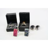 A collection of four 925 sterling silver gemstone rings together with a pair of silver earrings.