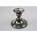 A fully hallmarked sterling silver candlestick with a Birmingham assay mark.