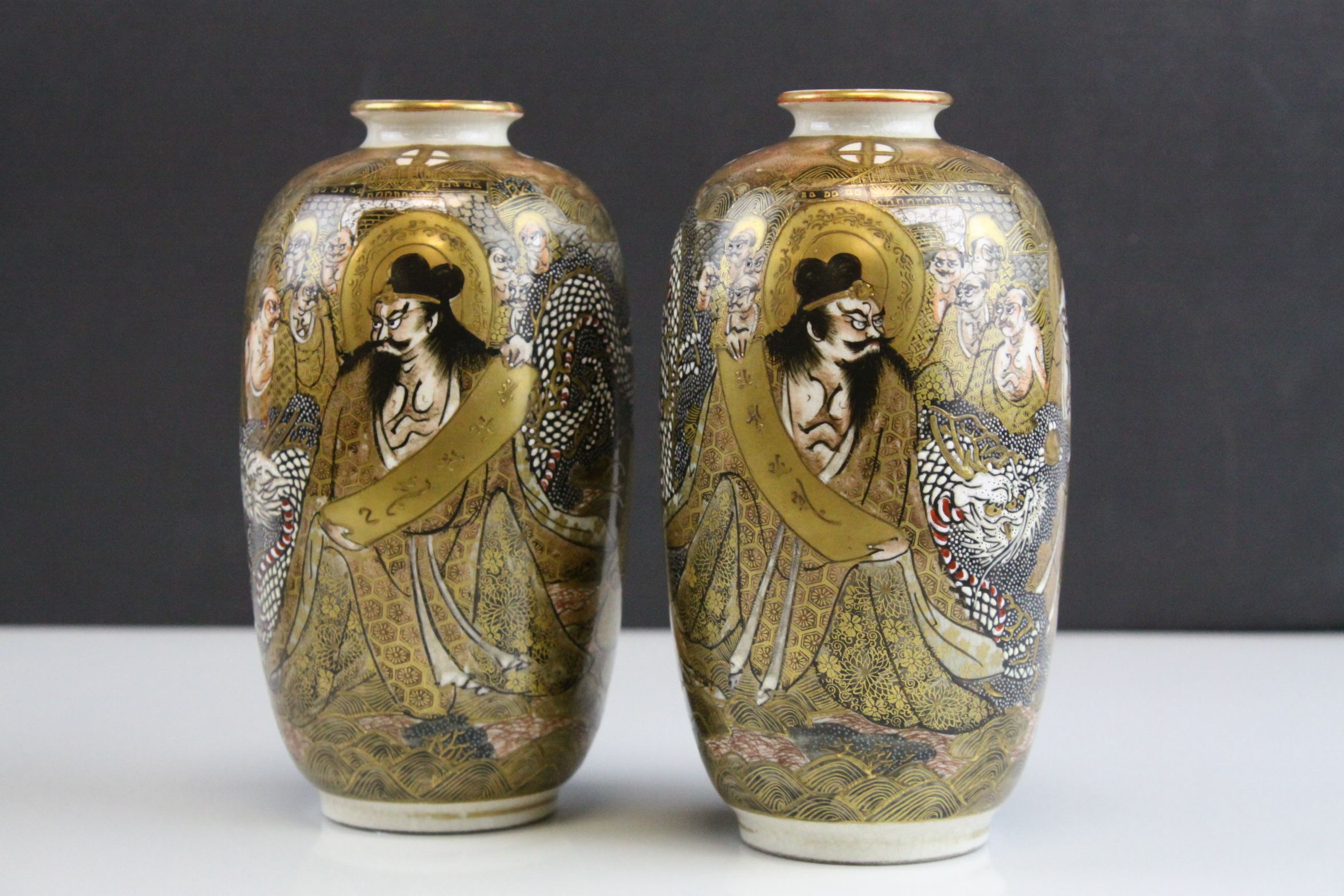 Pair of Japanese Meiji Period Satsuma Vases decorated with Immortals and Dragons, seal marks to