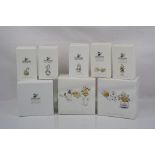 Collection of Swarovski crystal memories "flowers" Gold in original boxes.