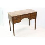 19th century Mahogany Writing Desk with four drawers around a kneehole space, raised on square legs,