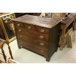 An antique oak chest of three short and three long drawers