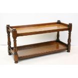 Oak Two Tier Coffee Table raised on turned baluster and block supports, 118cms long x 60cms high
