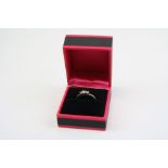 A 9CT Y/G three stone princess cut diamond ring.