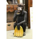 Large Carved Wooden Seated Monkey holding a Bunch of Bananas, 79cms high