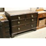 A small 18th century oak chest of two short and two long drawers