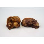 Netsuke of a recumbent deer and another of a lioness and cub (2)