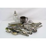 A collection of silver and silver plated items to include napkin ring, sugar shaker and wick