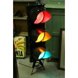 Freestanding Light formed from a Traffic Light raised on tripod base, 104cms high