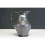 An early 20th century Kaiser Art Nouveau pewter jug with swagger decoration