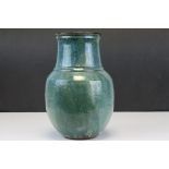 Studio Pottery Blue / Green Glazed Vase with a relief mark of a stylised vase, 26cms high