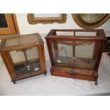 Wooden and Glass Cased Set of Chemist's Scales, 43cms high together with two similar sets (one