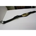 Gianfranco Ferre Italian black and gold leather belt with large oval plaque to centre, raised