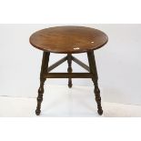 A late Victorian walnut cricket table