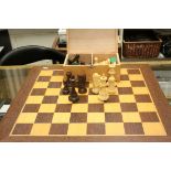 A boxed late 20th century Staunton chess set with board, paper label to inside of box.