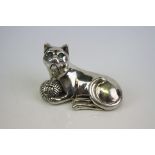 A silver cast figure of a cat Stamped sterling.