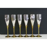 A set of six modernist brass and steel champagne flutes.