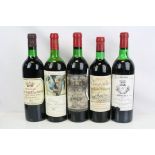 A collection of five bottles of vintage wine to include Chateau Mouton Rothschild 1973, Chateau