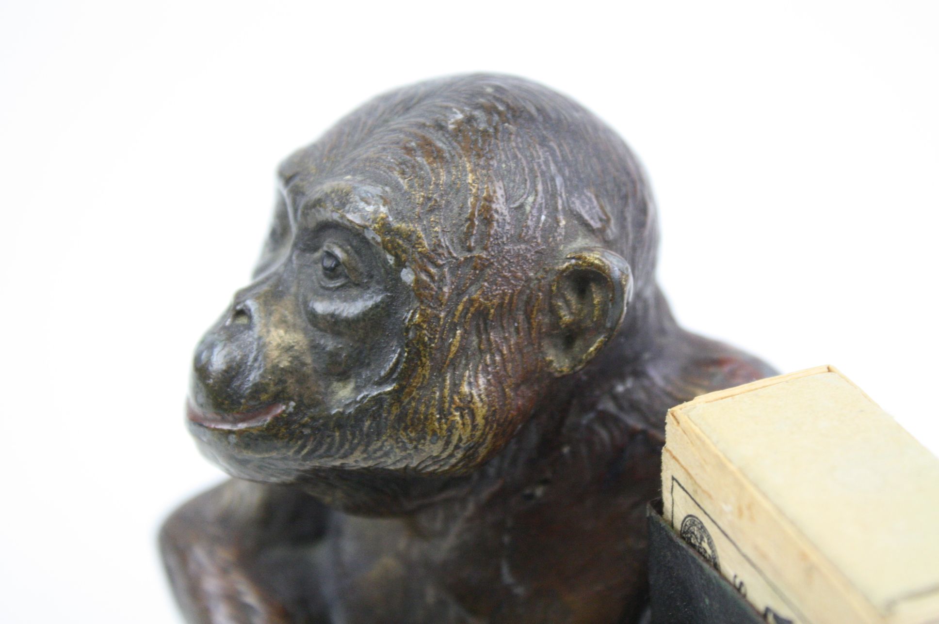 An early 20th century cold painted spelter match holder in the form of a monkey. - Image 5 of 6