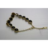 Yves Saint Laurent vintage necklace, thirteen black ebony cabochons with diamante surround, simple