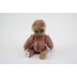 An early 20th century Schuco Monkey Compact with mirror.