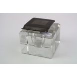 A fully hallmarked sterling silver topped glass inkwell with engine turned decoration to the lid,