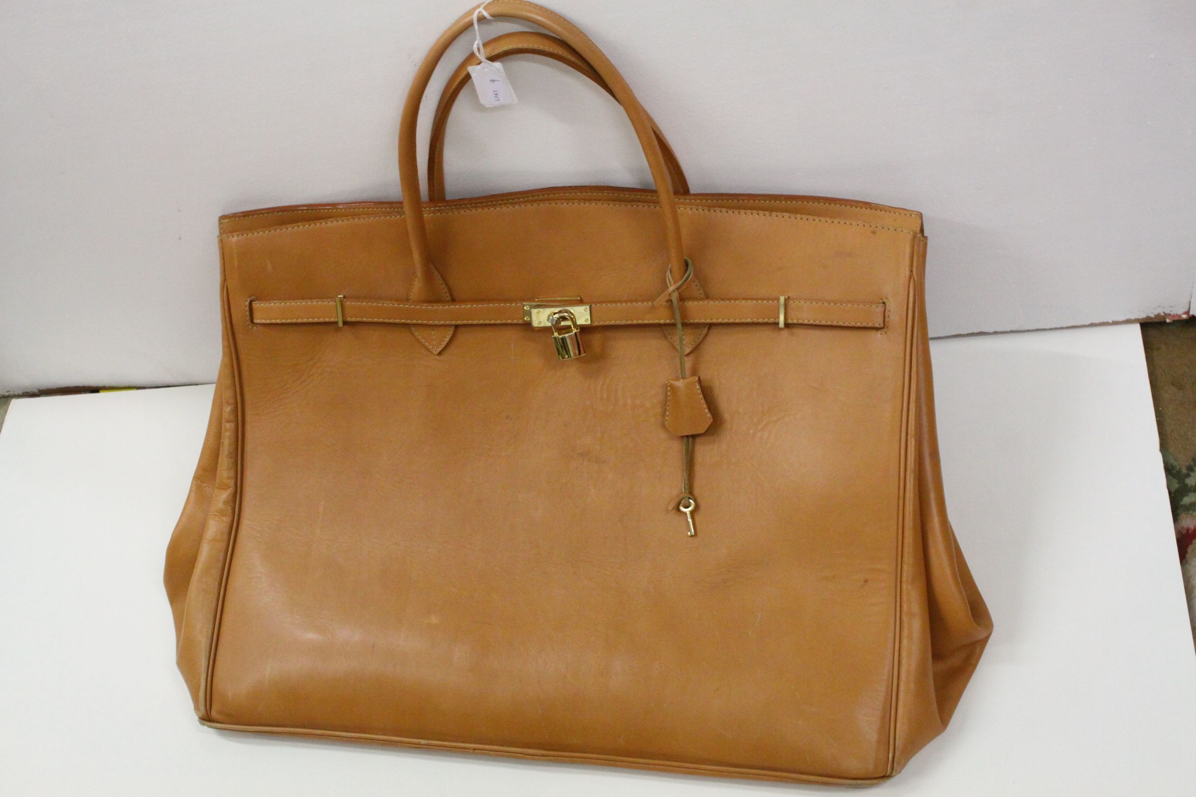 Large birkin style tan leather travel bag, leather interior, padlock clasp with key, width approx