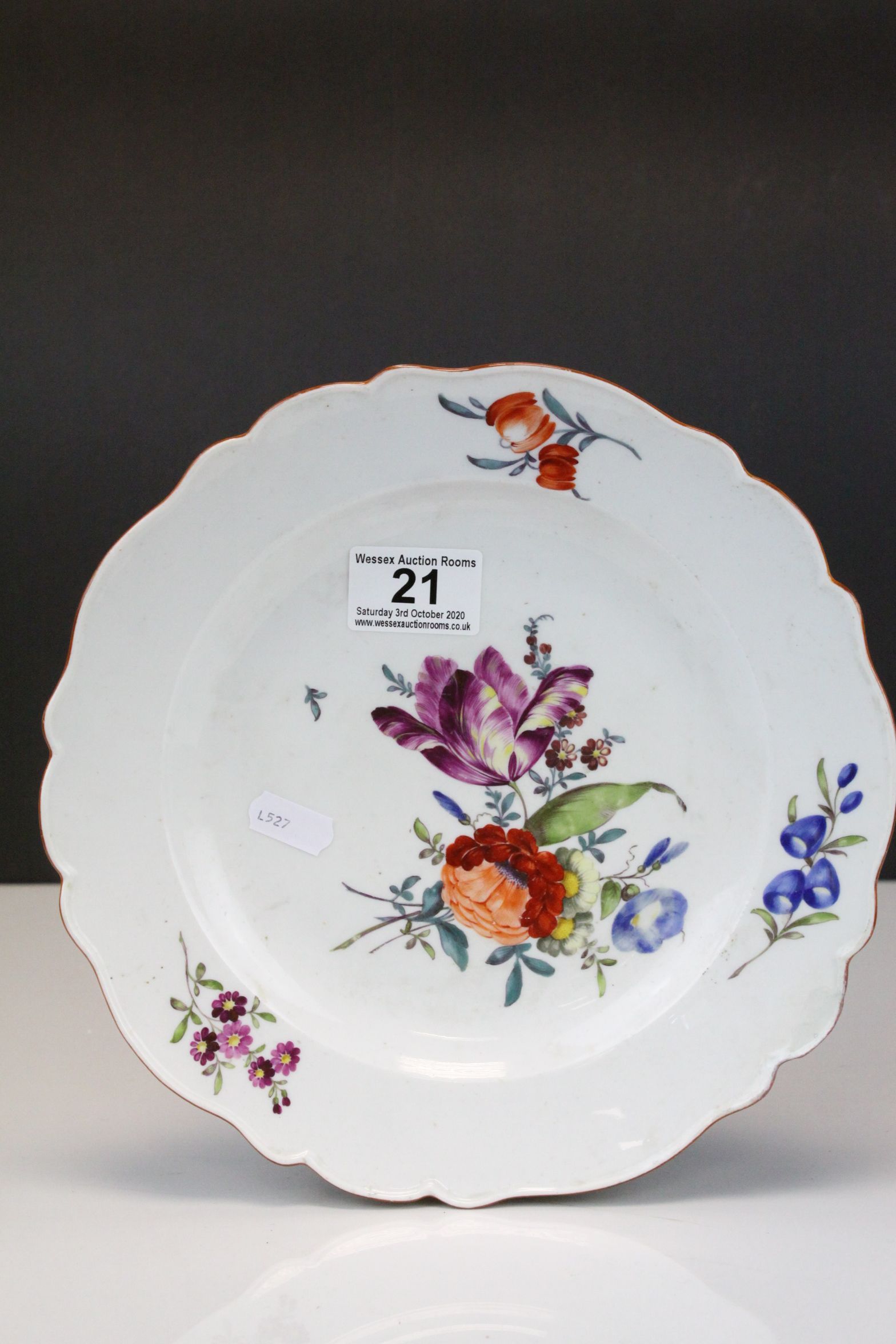 An early 20th century Meissen cabinet plate with floral decoration crossed sword mark to underside.