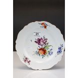 An early 20th century Meissen cabinet plate with floral decoration crossed sword mark to underside.