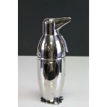 A silver plated novelty penguin cocktail shaker.