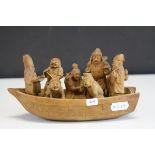 Chinese Wooden Carved Boat containing Seven Chinese Figures, signed to base, 19cms long