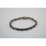 A silver 925 amethyst line bracelet.