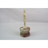 Art Deco ivory nude figurine on a polished onyx base.