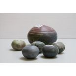 Five studio pottery scupltures in the form of stones together with one other larger no makers mark.