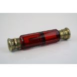 A fully hallmarked sterling silver and ruby glass double ended scent bottle by Sampson & Mordon.