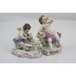 A pair of early 20th century cherub figures with cross sword mark to base.