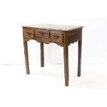 George III Fruitwood Country Side Table with Three Drawers, Shaped Apron and raised on square