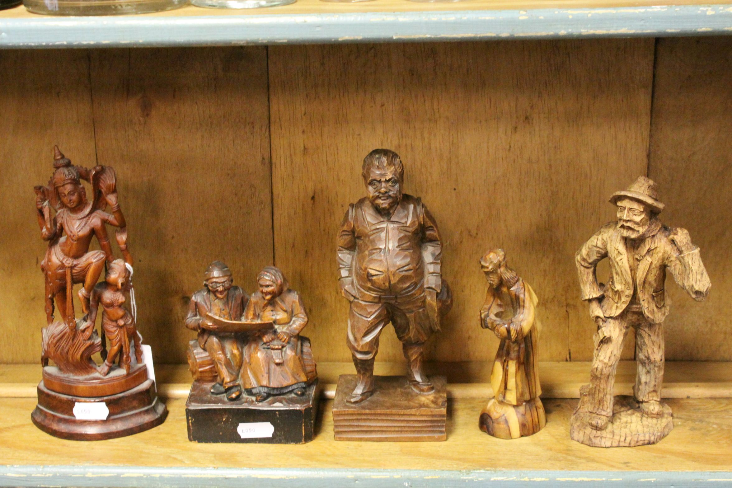 Four Eastern Europe Wooden Carved Figures (tallest 21cms) together with a Carved Wooden South East